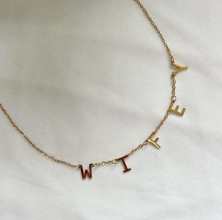 Gold WIFEY necklace close-up