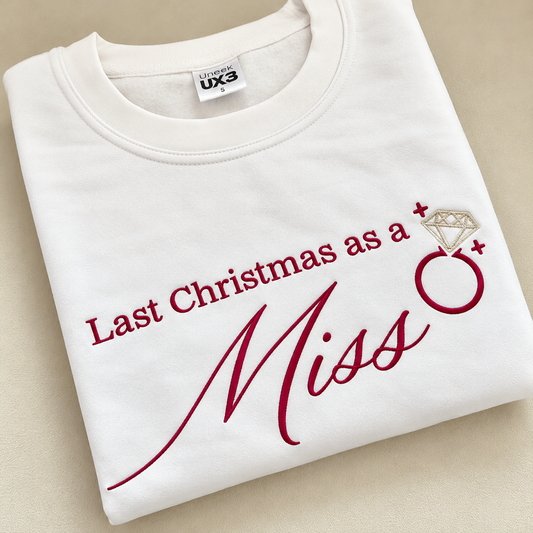 Last Christmas as a Miss burgundy embroidered bridal sweatshirt